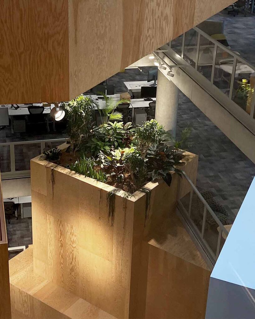 Meta Office London, UK. Interior landscaping service with box planting and hanging plant designs
